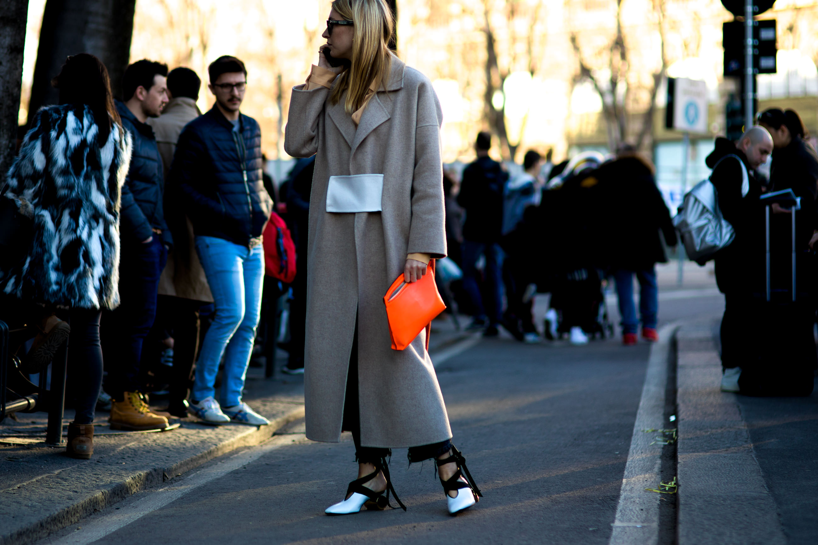 MFW FW17 Street Style: Fashion blogger Camille Charrière wearing a coat and JW Anderson shoes after the Jil Sander fashion show in Milan, Italy