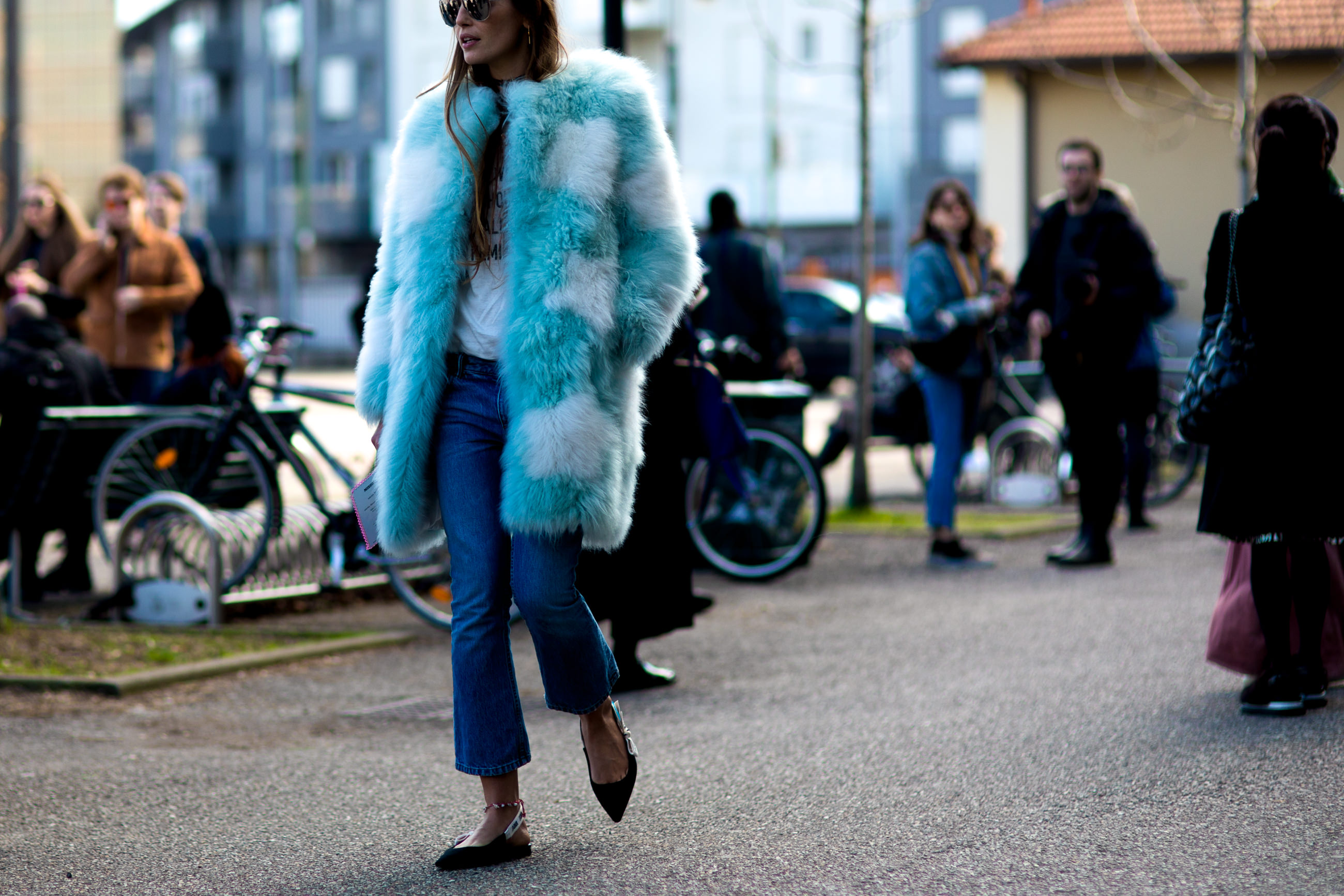 MFW FW17 Street Style: Carlotta Oddi wearing a blue fur coat, jeans and Dior pointy flats before a fashion show in Milan, Italy