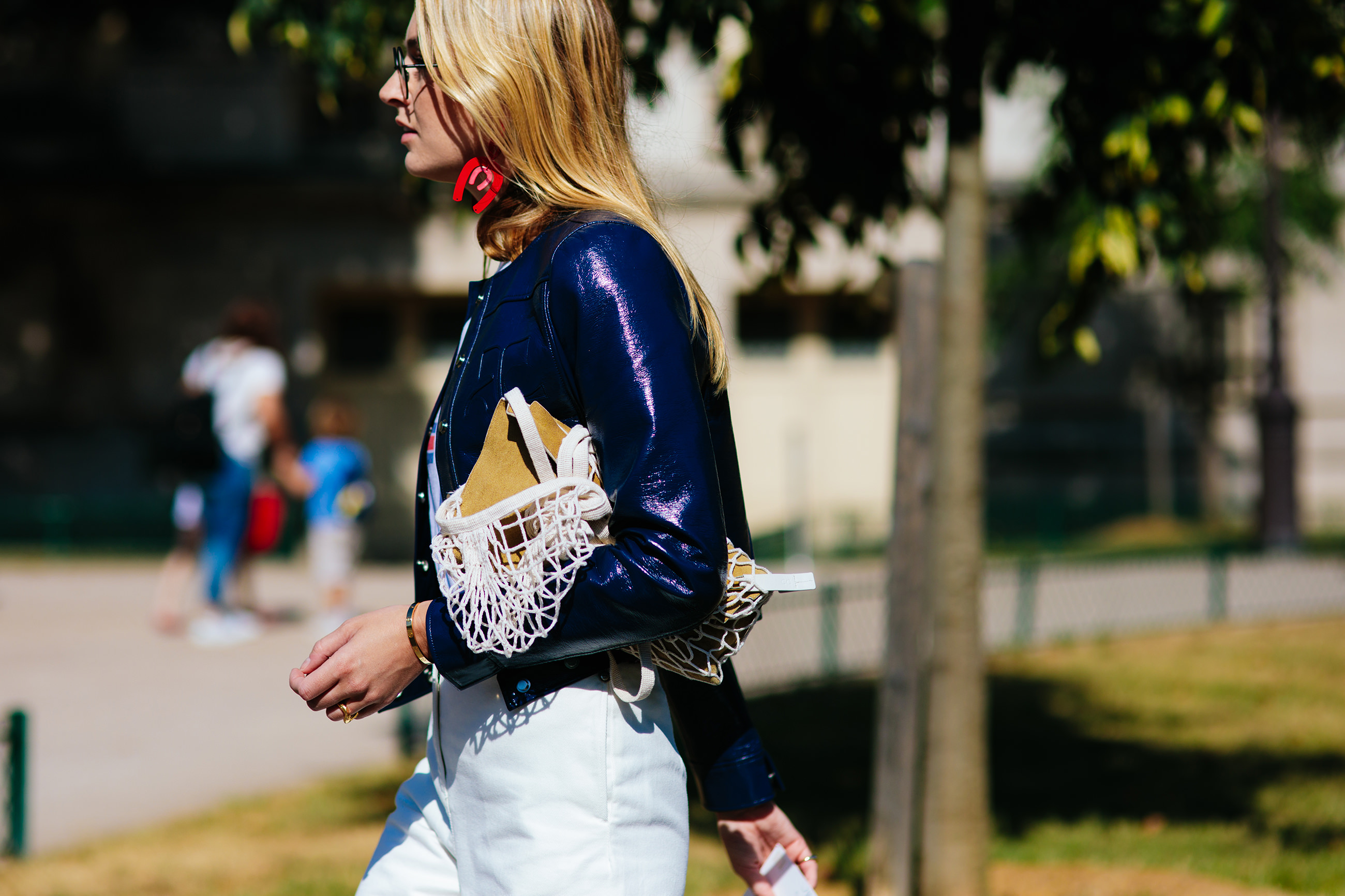 Camille Charrière wearing a blue jacket and white jeans before the Chanel Couture fashion show in Paris, France
