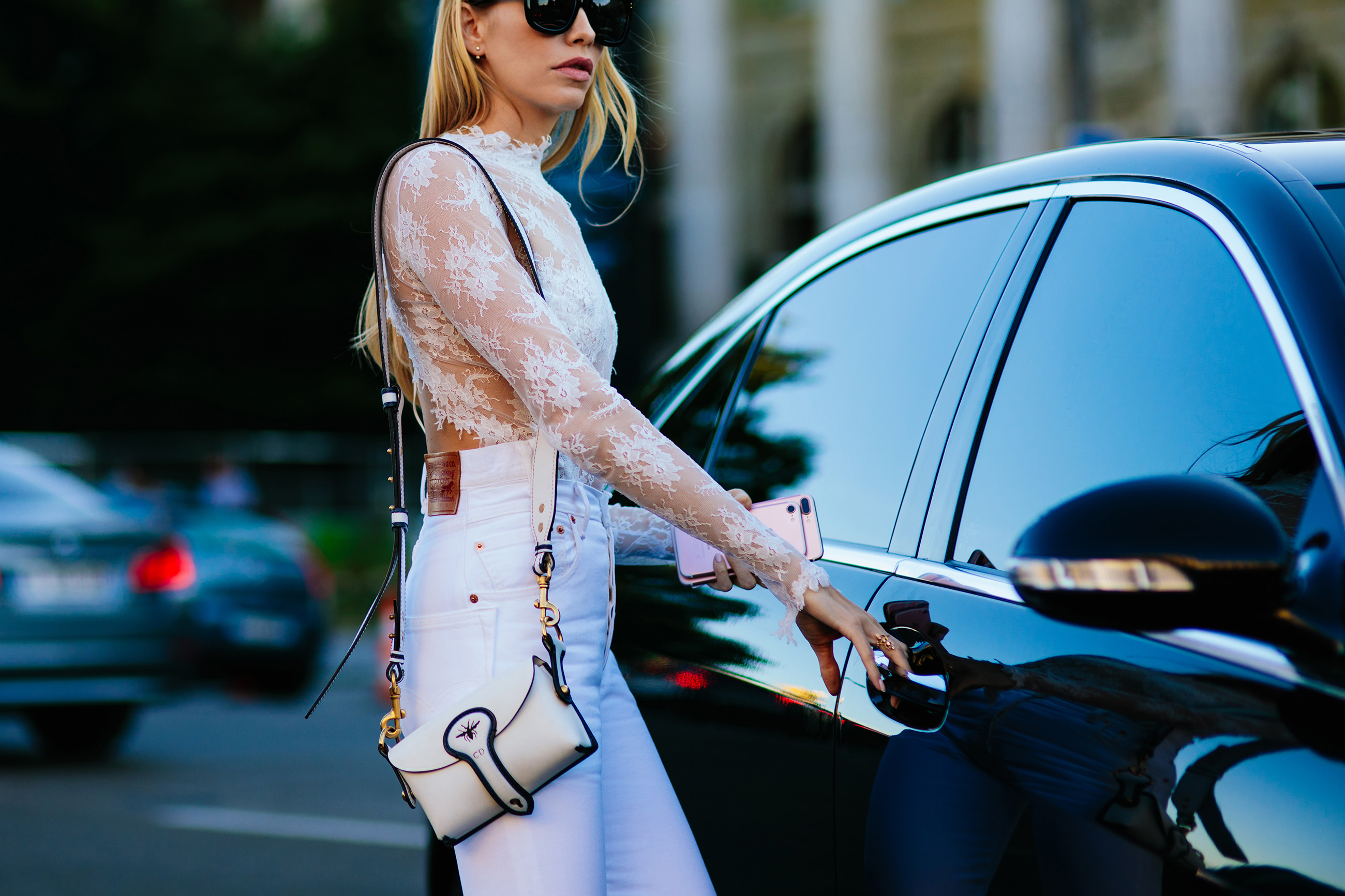 Elena Perminova wearing white Vetements x Levis  jeans and white lace top after the Dior Couture Fashion Show