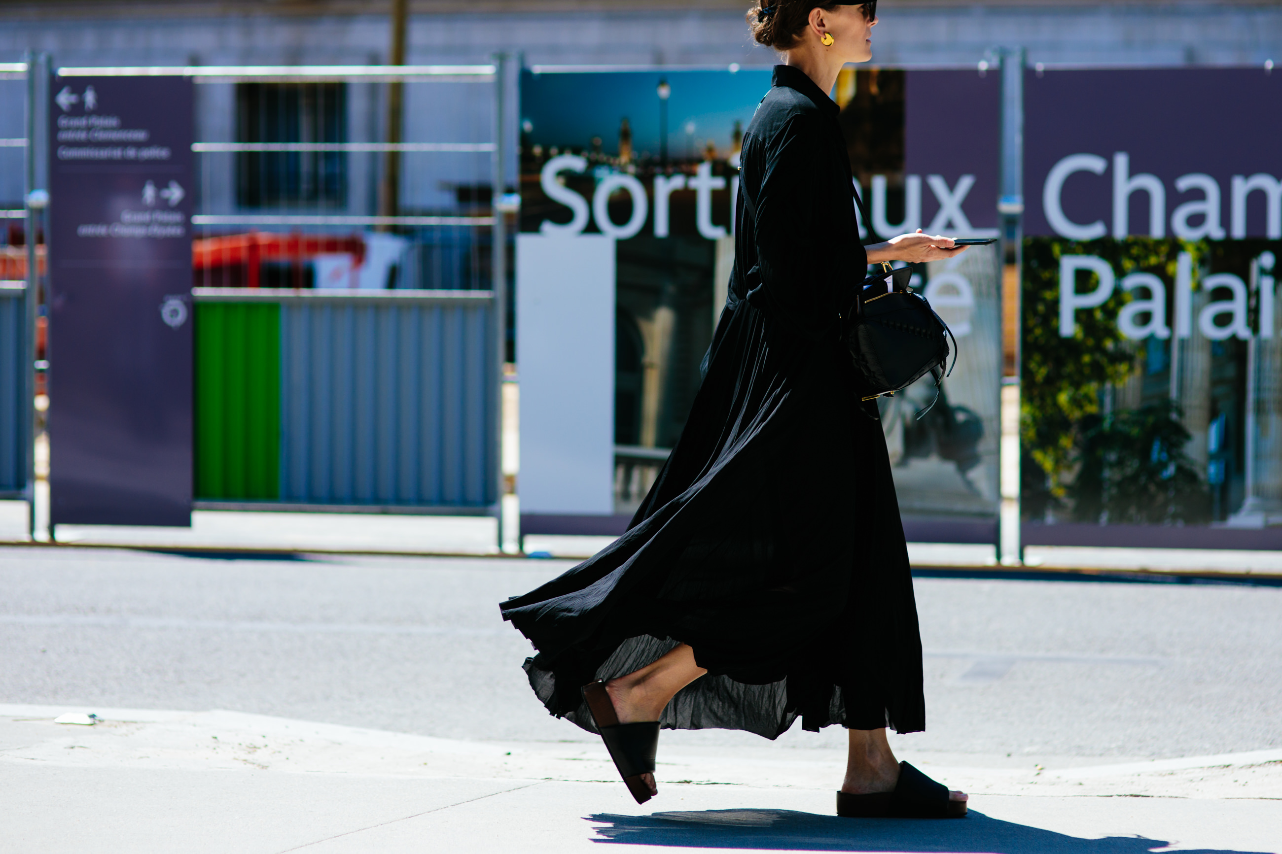 Jo Ellison wearing a black celine dress and platform slides after the Chanel Haute Couture fashion show in Paris, France