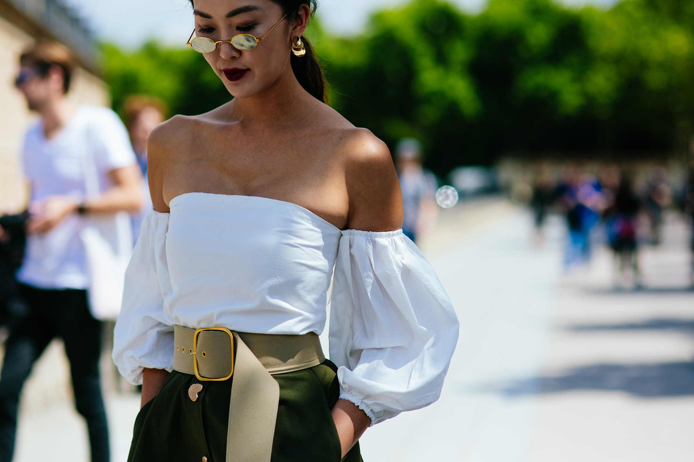 korean street style star wearing a white top in Paris