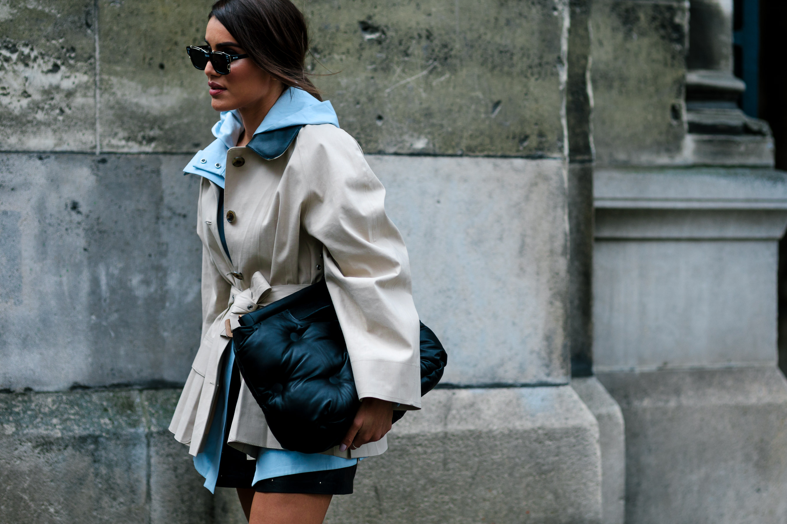 brazilian woman wearing short trench and dior sunglasses