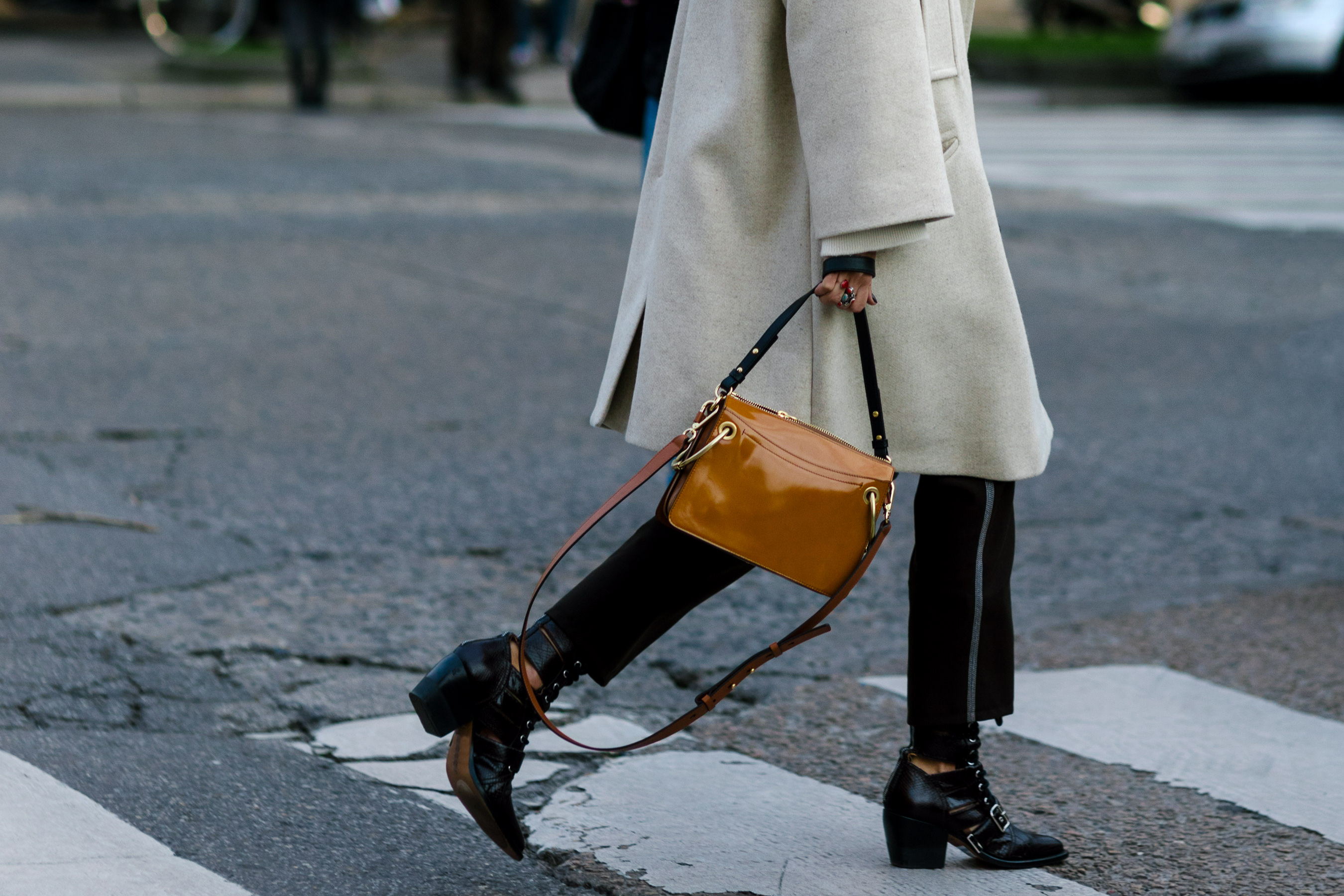 Italian woman walking wearing Chloe boots and bag