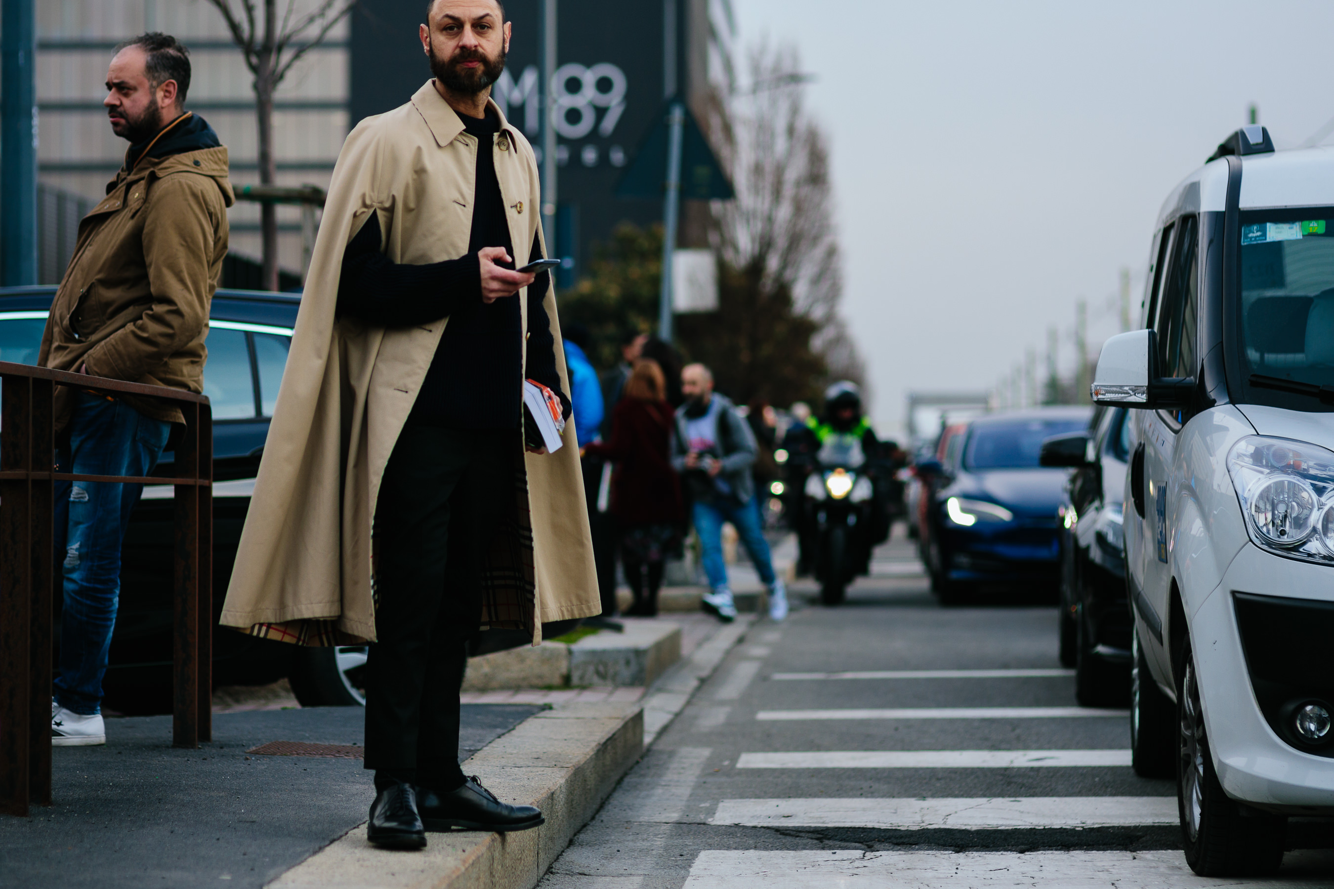 man wearing Burberry trench cape coat