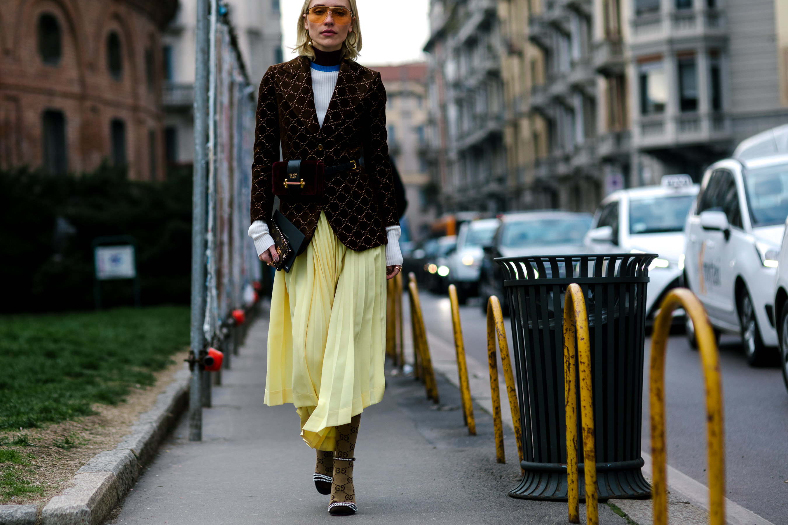 Blonde woman wearing Gucci and Celine yellow dress