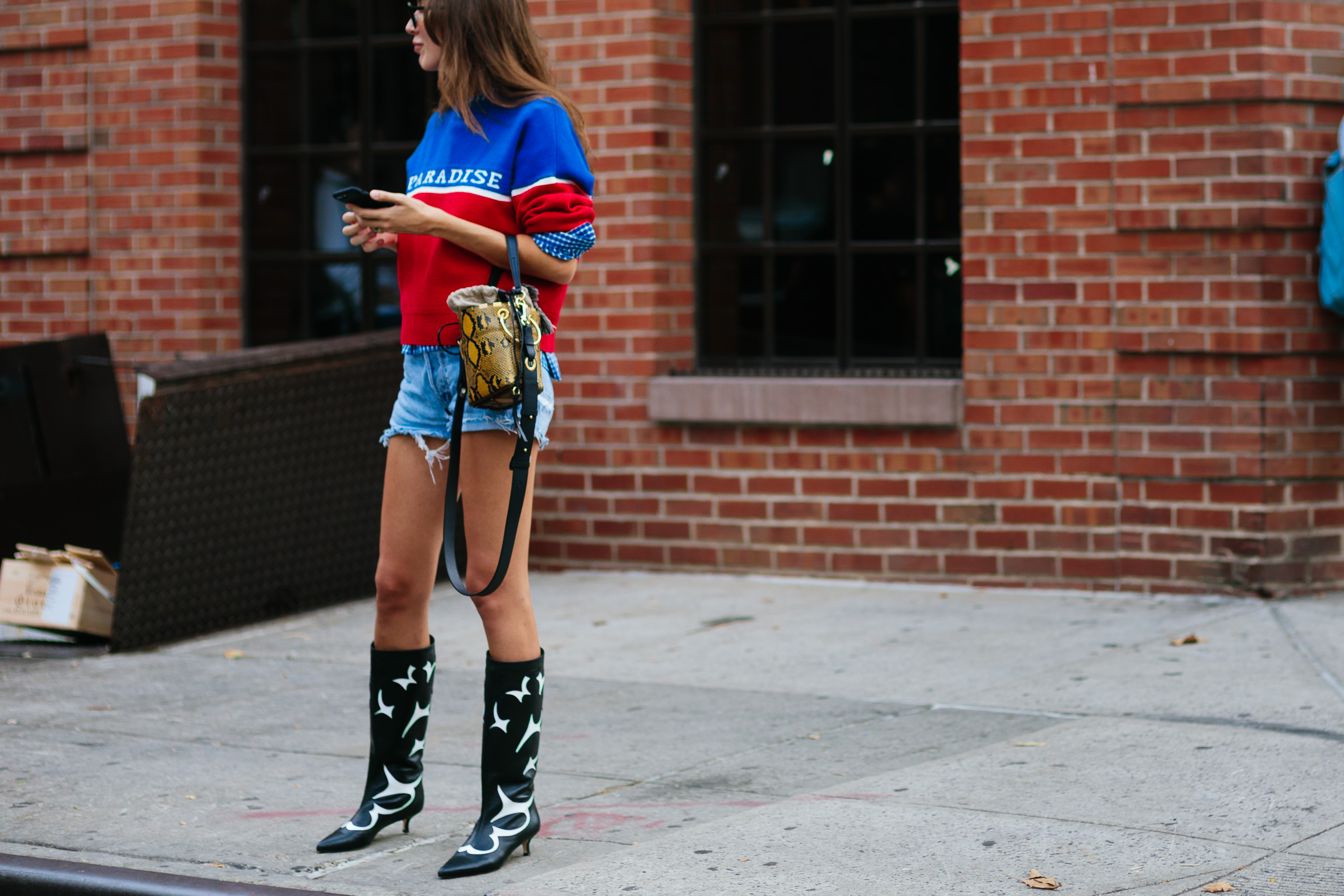 french woman wearing denim shorts and boots in NY