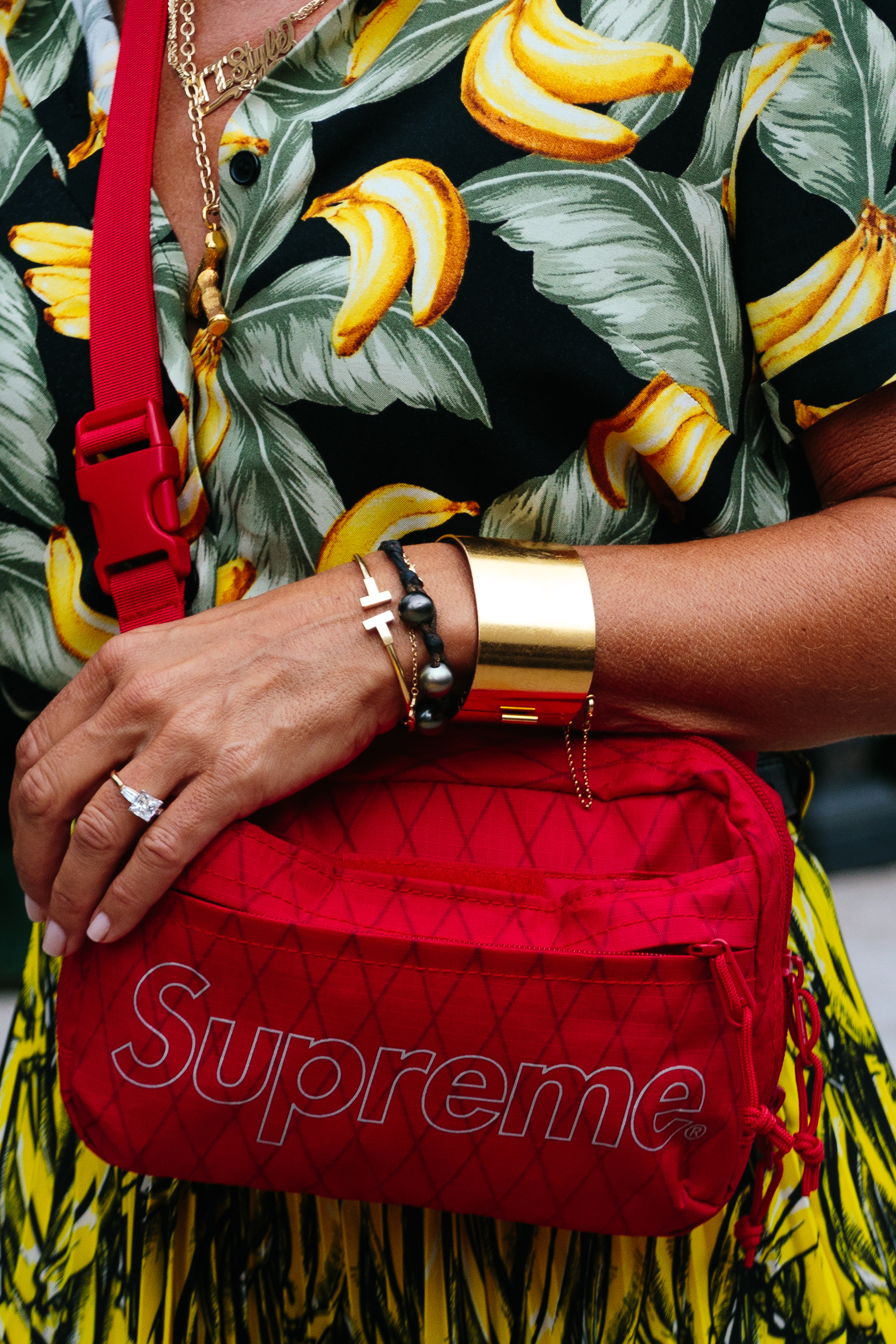 woman wearing Supreme bag in NYC