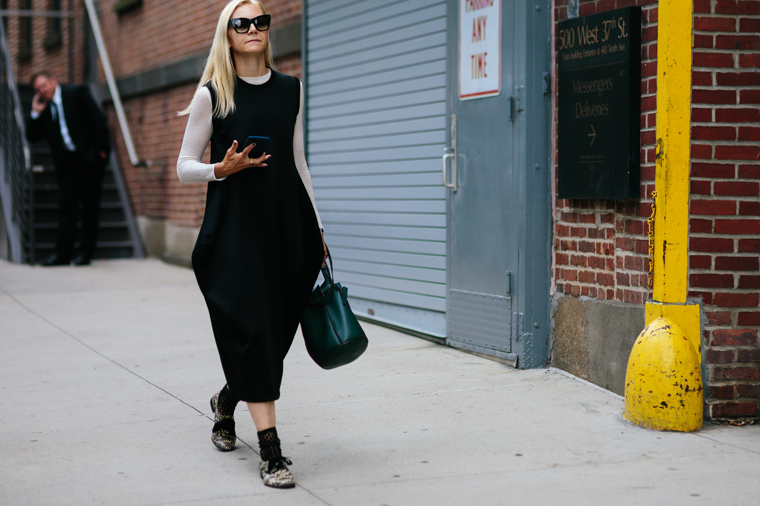 woman wearing black dress and flas in NYC