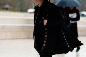 Nicole Warne wearing a black Christopher Esber dress and Ryan Storer earrings after the Louis Vuitton Fall/Winter 2016-2017 fashion show in Paris, France