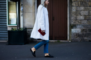 PFW Street Style: Vogue UK's Sarah Harris wearing a white fur coat and Robert Clergerie slippers after a show in Paris, France